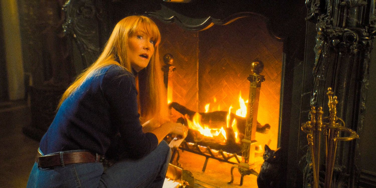 Linda Shaw, surprised, about to burn some papers in the fireplace in Palm Royale S1 Ep1,2,3