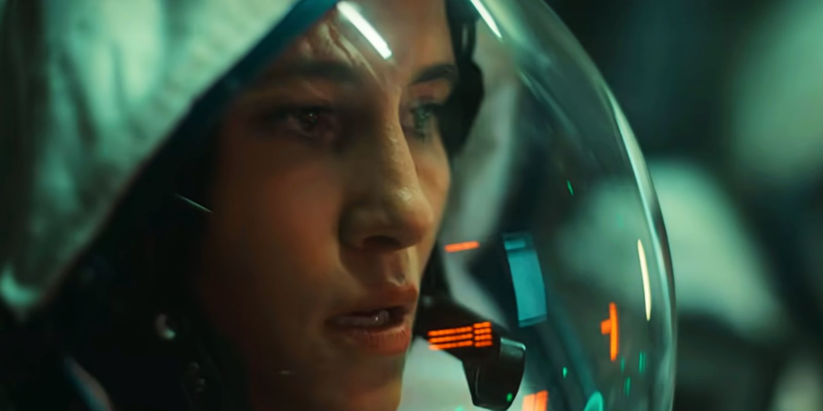 Paula in a spacesuit in the landing capsule in The Signal