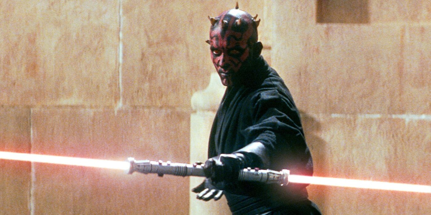 Darth Maul holding his double-sided lightsaber in front of him in The Phantom menace