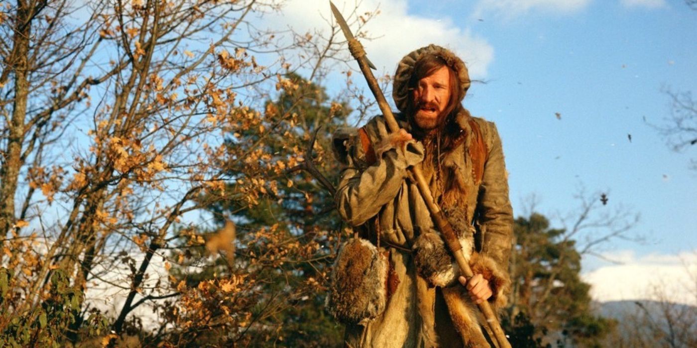 Richard Harris as Zachary Bass stands with a spear in Man in the Wilderness.
