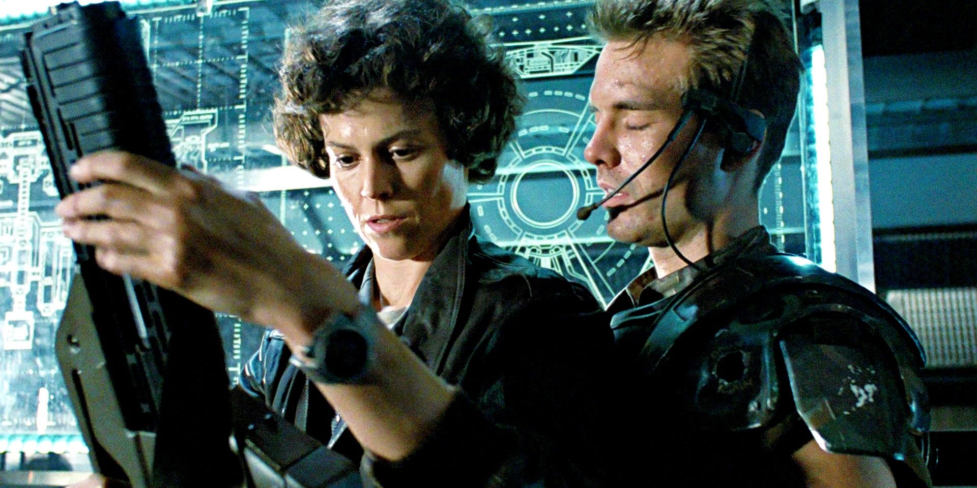 Ripley looking at her blaster while someone behind her is talking to her in Aliens