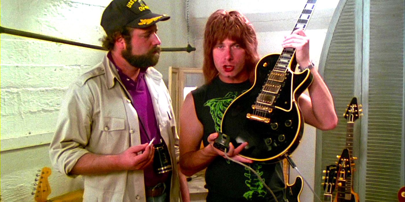 Christopher Guest shows Rob Reiner his guitar in a scene from This is Spinal Tap
