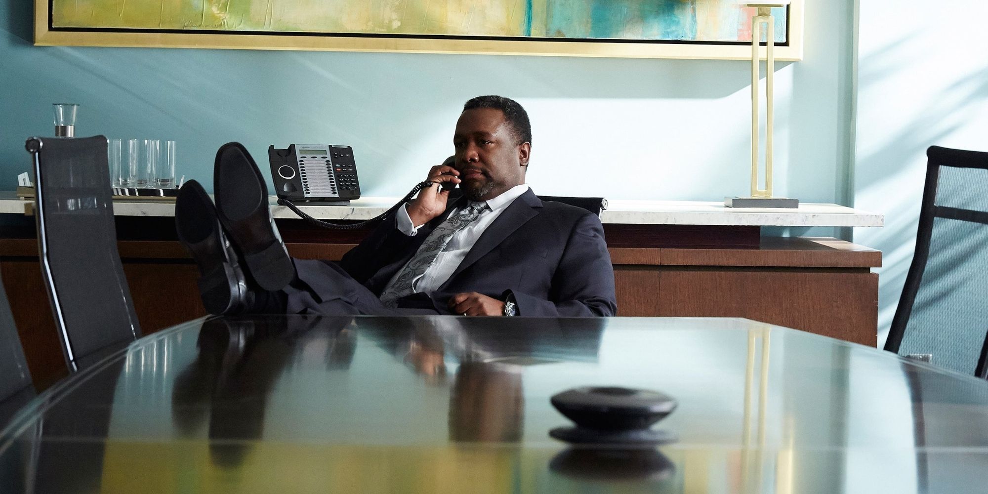 Robert Zane with his feet up in Suits season 5 episode No Refills