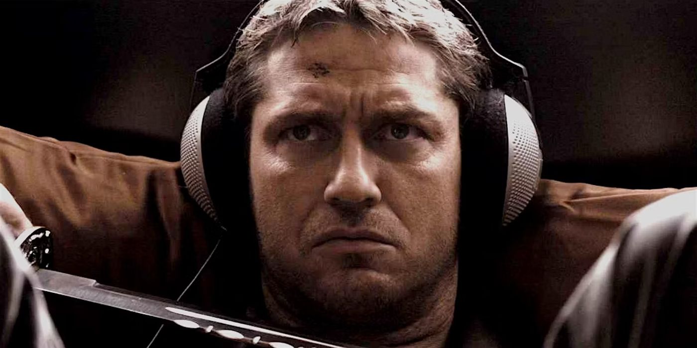 Gerard Butler as One-Two wearing headphones and glaring in RocknRolla