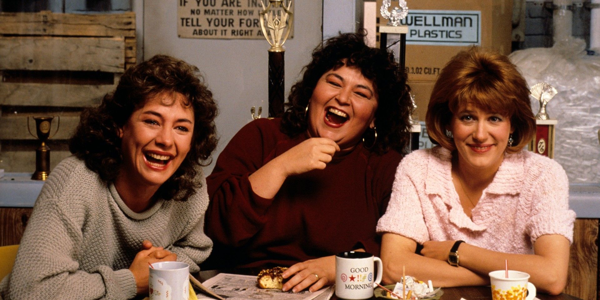Roseanne laughing with two of her friends (one of whom is Crystal) on Roseanne