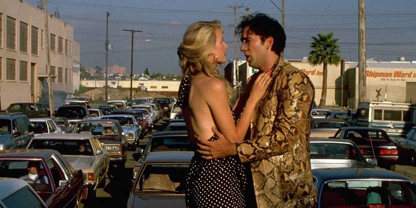 Sailor (Nicolas Cage) and Lula (Laura Dern) embrace on top of the car at the end of Wild at Heart