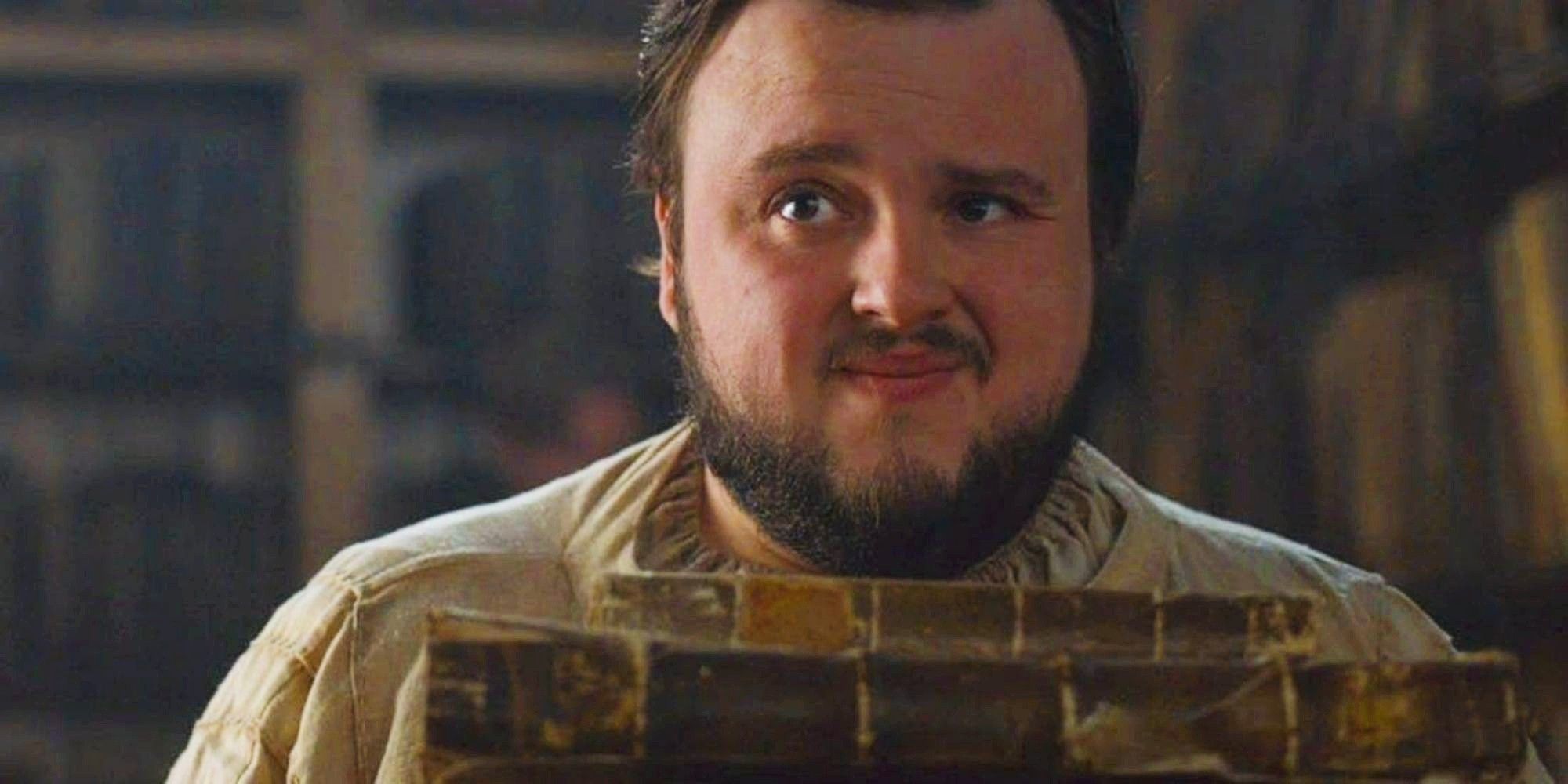 Samwell Tarly holding books at the Citadel in Game of Thrones