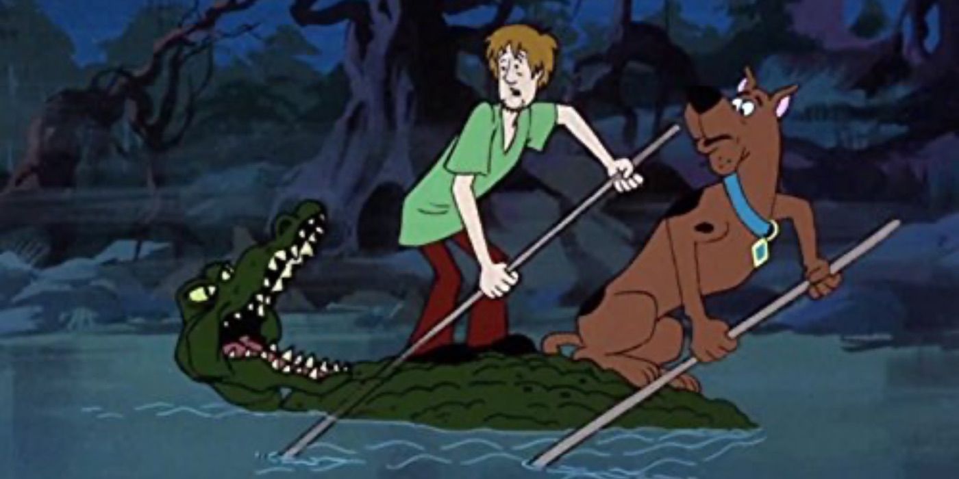 Scooby and Shaggy riding on the back of an alligator