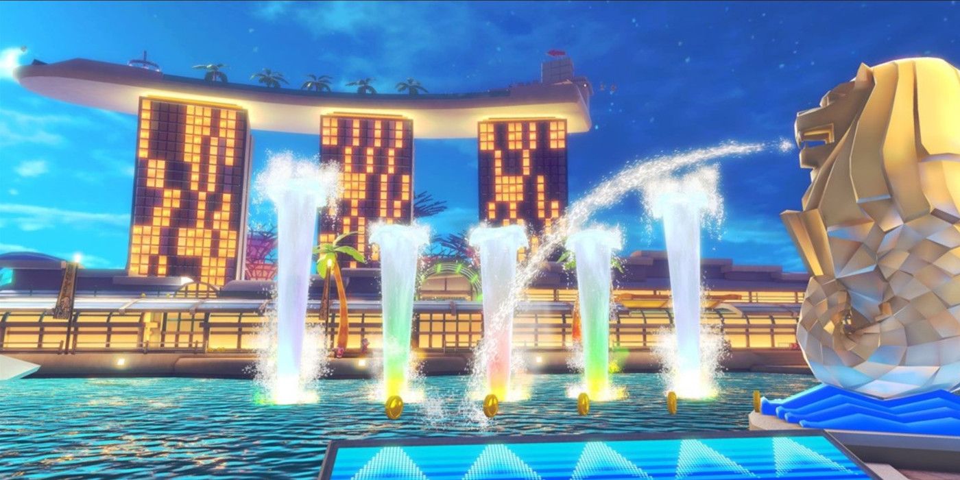 Singapore Speedway Mario Kart track with a river with water shooting up, a Dash Panel and lit buildings in the back.