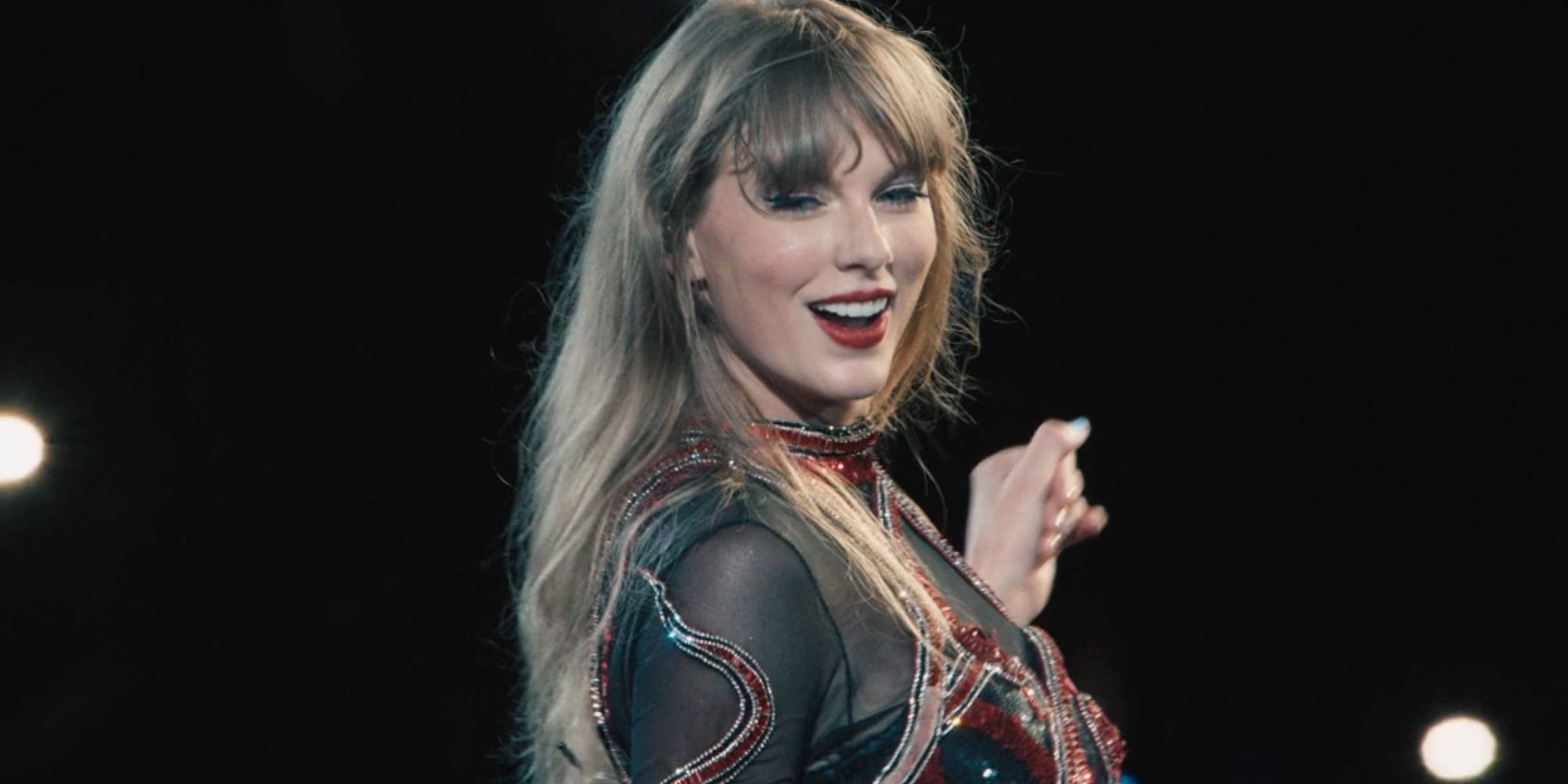 Taylor Swift smiling during Delicate in The Eras Tour