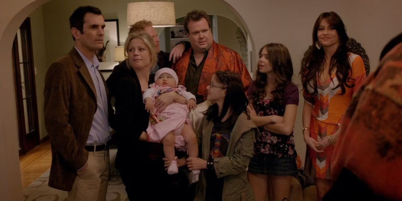 The cast of Modern Family meeting Lily for the first time