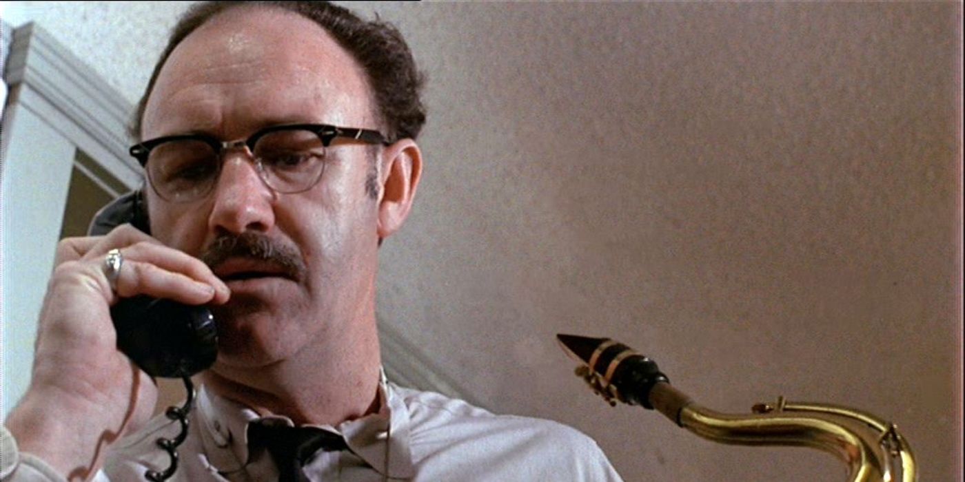 Gene Hackman on the phone looking concerned in The Conversation