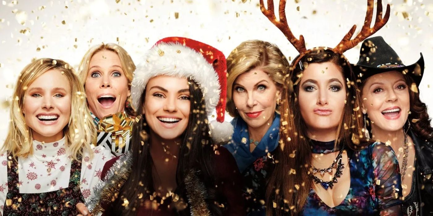 The main cast of A Bad Moms Christmas all smiling next to one another.