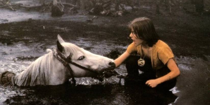 Artax and Atreyu in a pit of mud in The NeverEnding Story