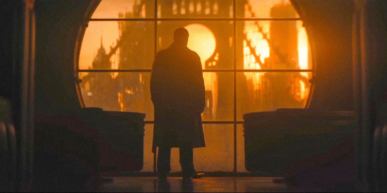 Wide shot of the Penguin contemplating a sunset in Gotham City through a large circular window in The Penguin official teaser