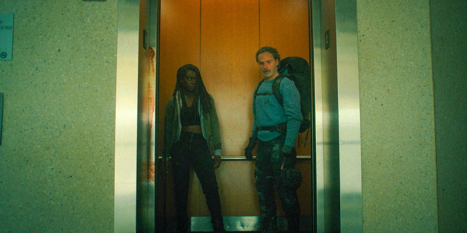 Michonne Hawthorne and Rick Grimes taking the elevator down looking out of it in The Walking Dead: The Ones Who Live