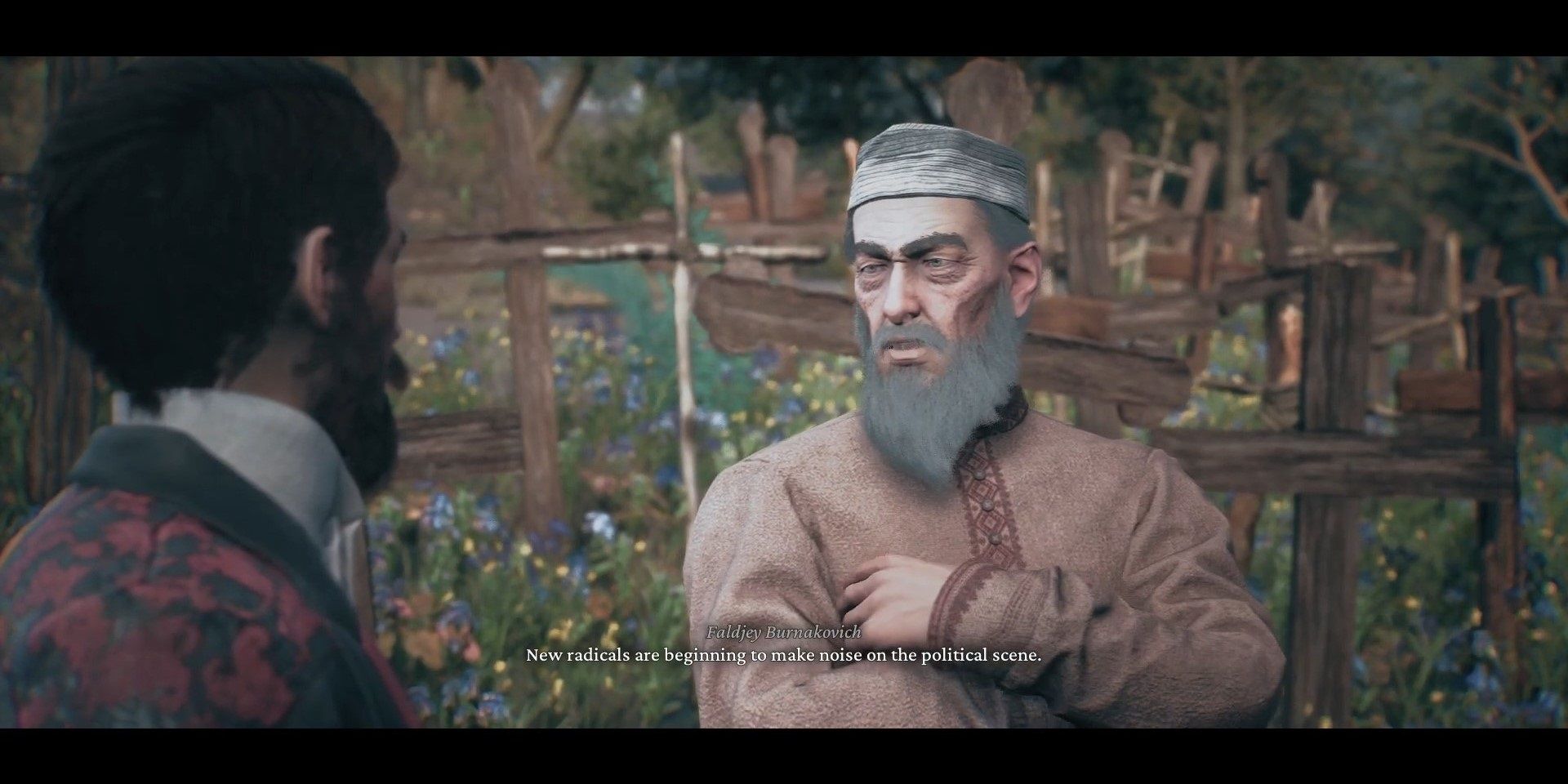 Wiktor e Burnakovich do Taumaturgo, conversando em um cemitério coberto de flores.