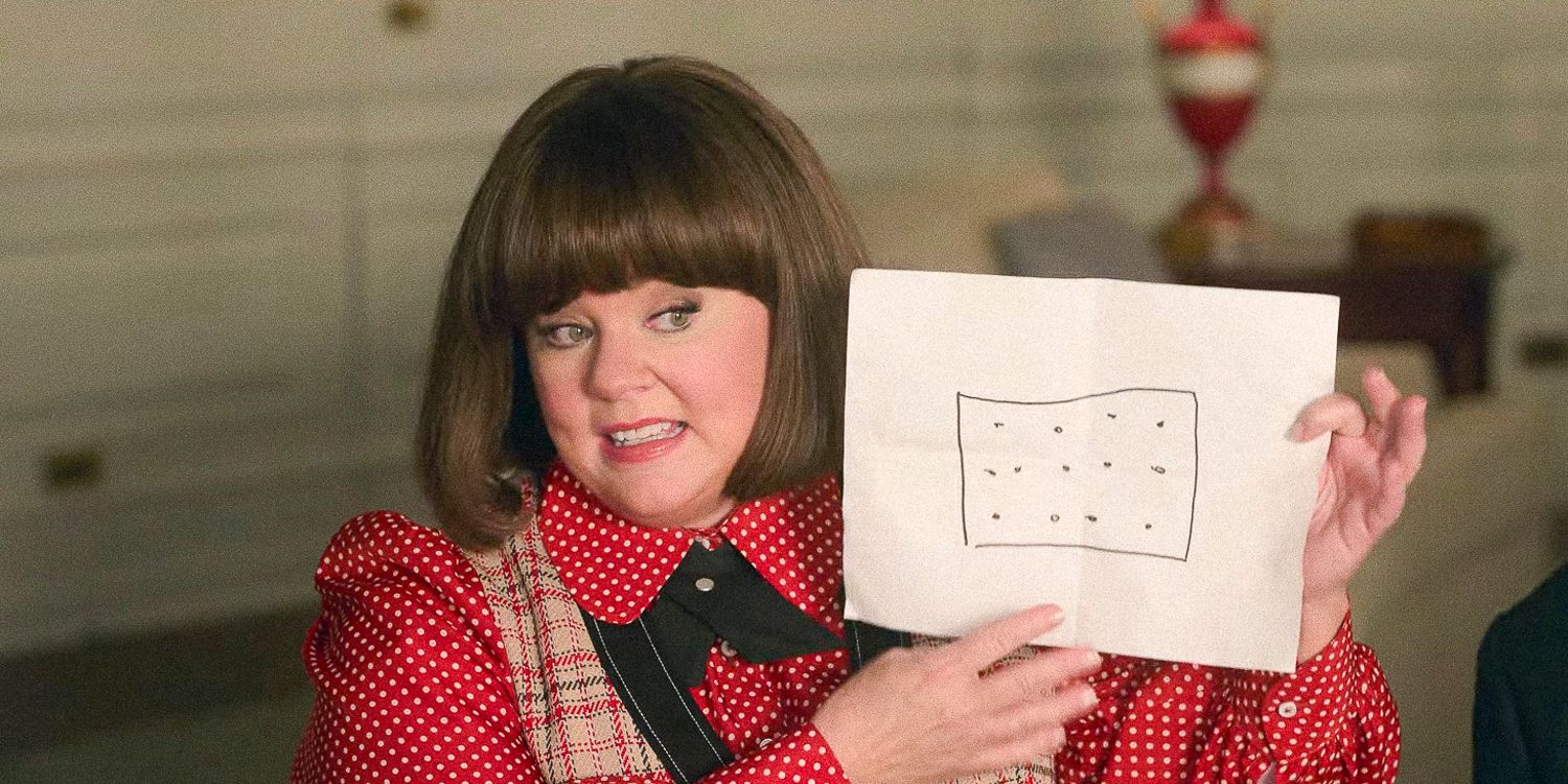 Melissa McCarthy holding a drawing of a pop tart in Unfrosted: The Pop-Tart Story