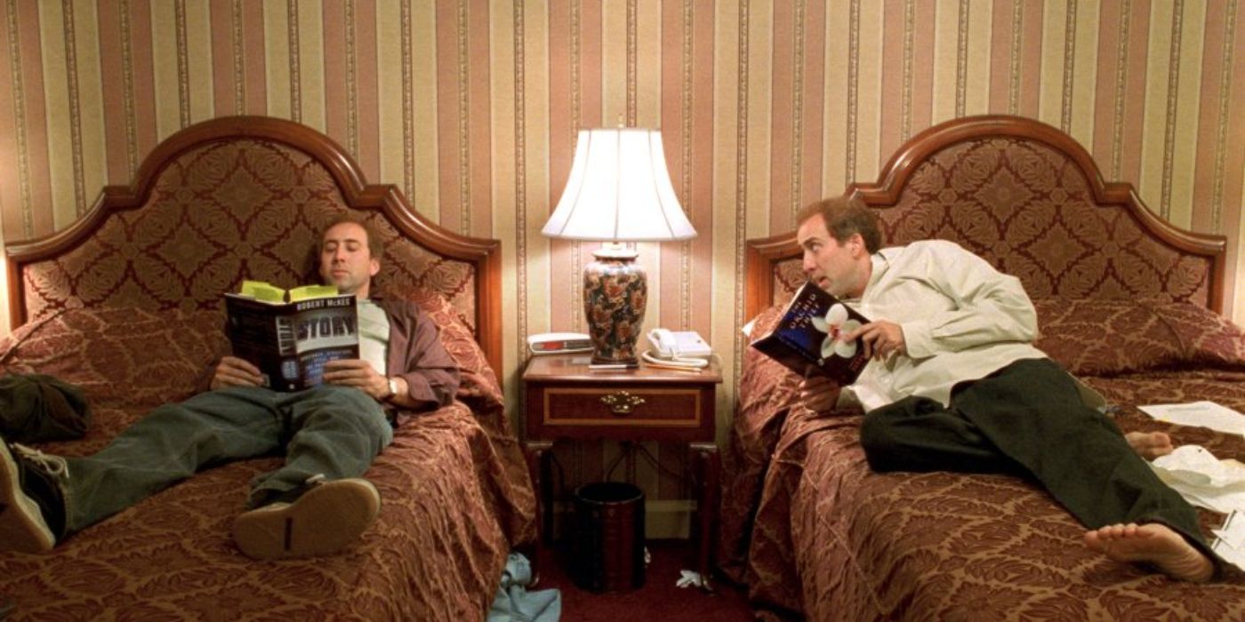 Nicolas Cage as Donald and Charlie Kaufman, lying on their beds and reading, in Adaptation