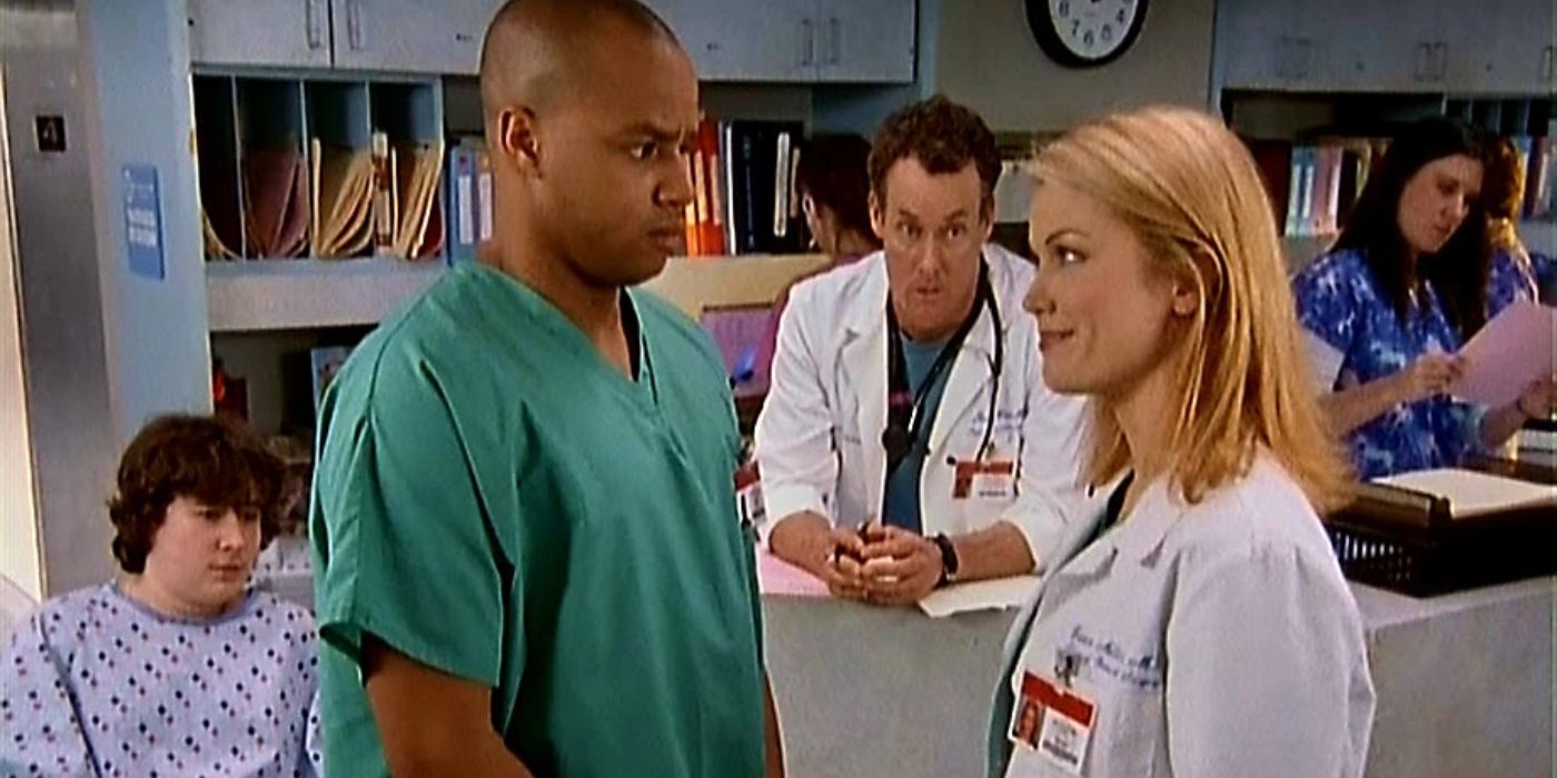 Dr. Cox watching Dr. Miller and Turk chatting in Scrubs