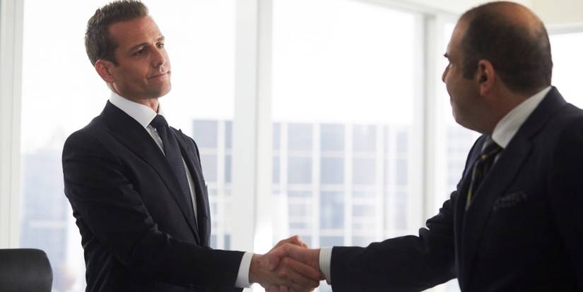 Harvey and Louis shaking hands after chatting in the season 8 episode Good Mudding