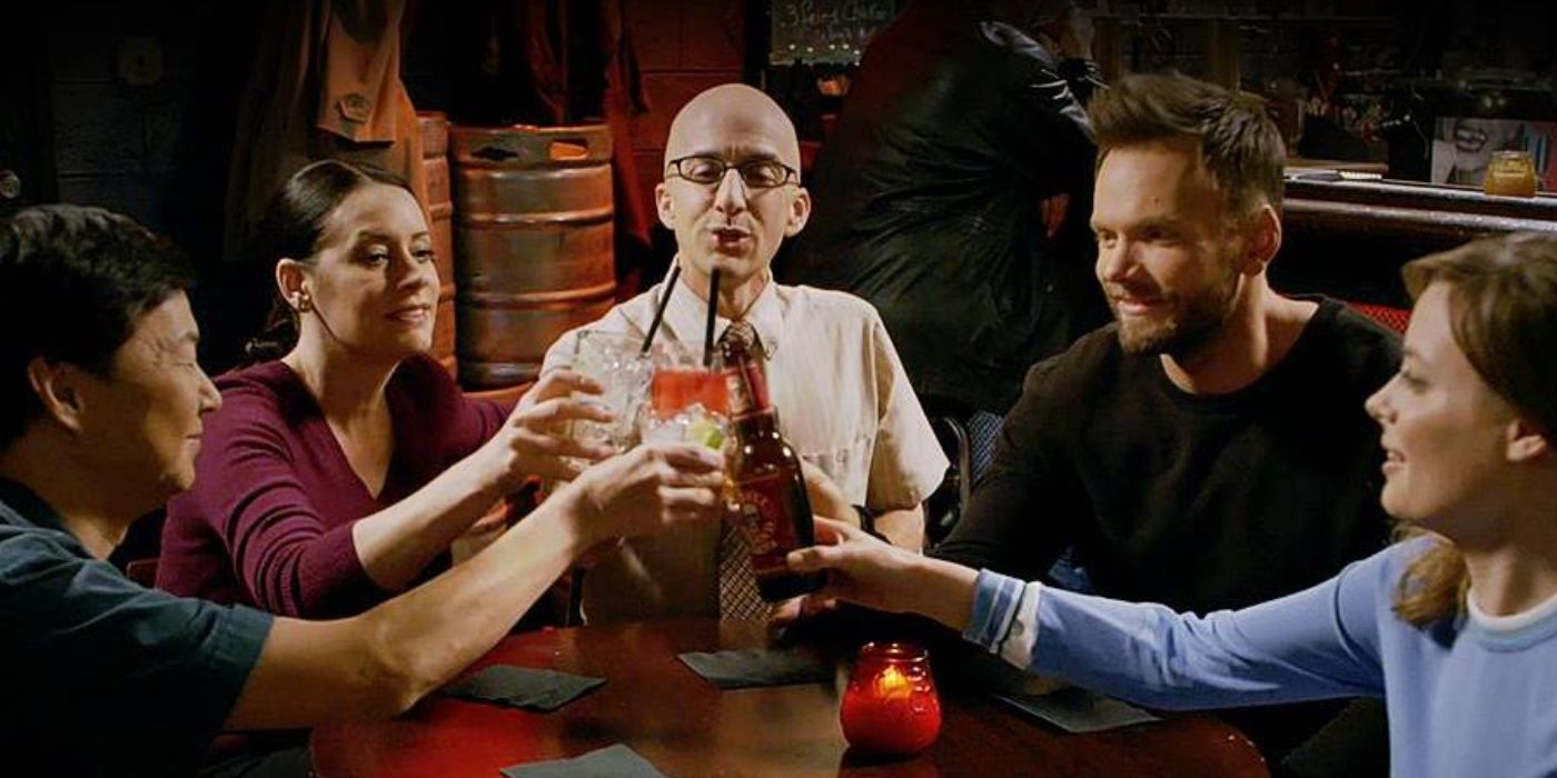 Britta (Gillian Jacobs), Jeff (Joel McHale), the Dean (Jim Rash), Chang (Ken Jeong), and Frankie (Paget Brewster) making a toast in the Community finale.