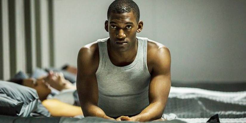Malachi Kirby as Stripe sat in his army bunk in the Black Mirror episode Men Against Fire