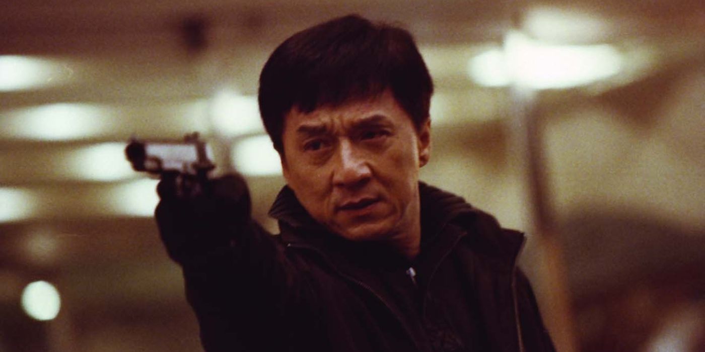 Jackie Chan as Steelhead pointing a gun in the 2009 film Shinjuku Incident