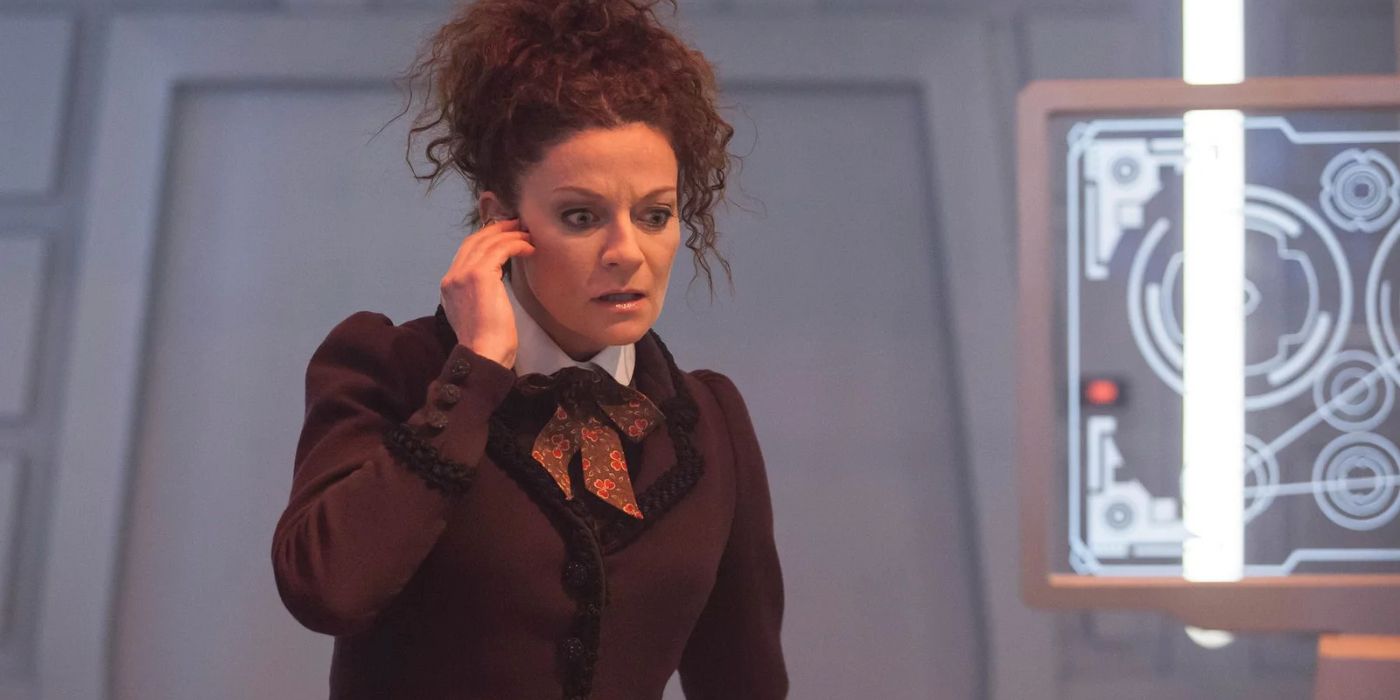 Michelle Gomez as Missy with a device in her ear in the Doctor Who episode World Enough and Time