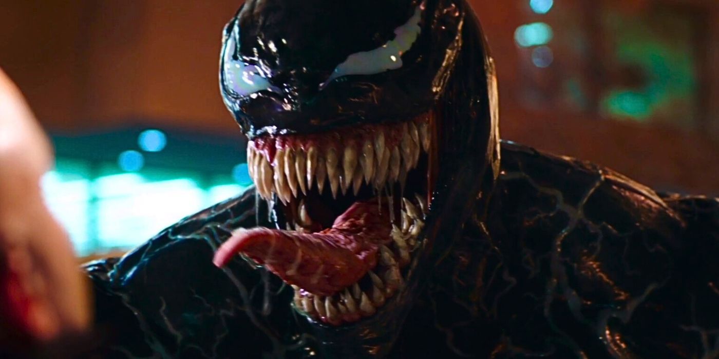 Venom snarls in a man's face in Venom