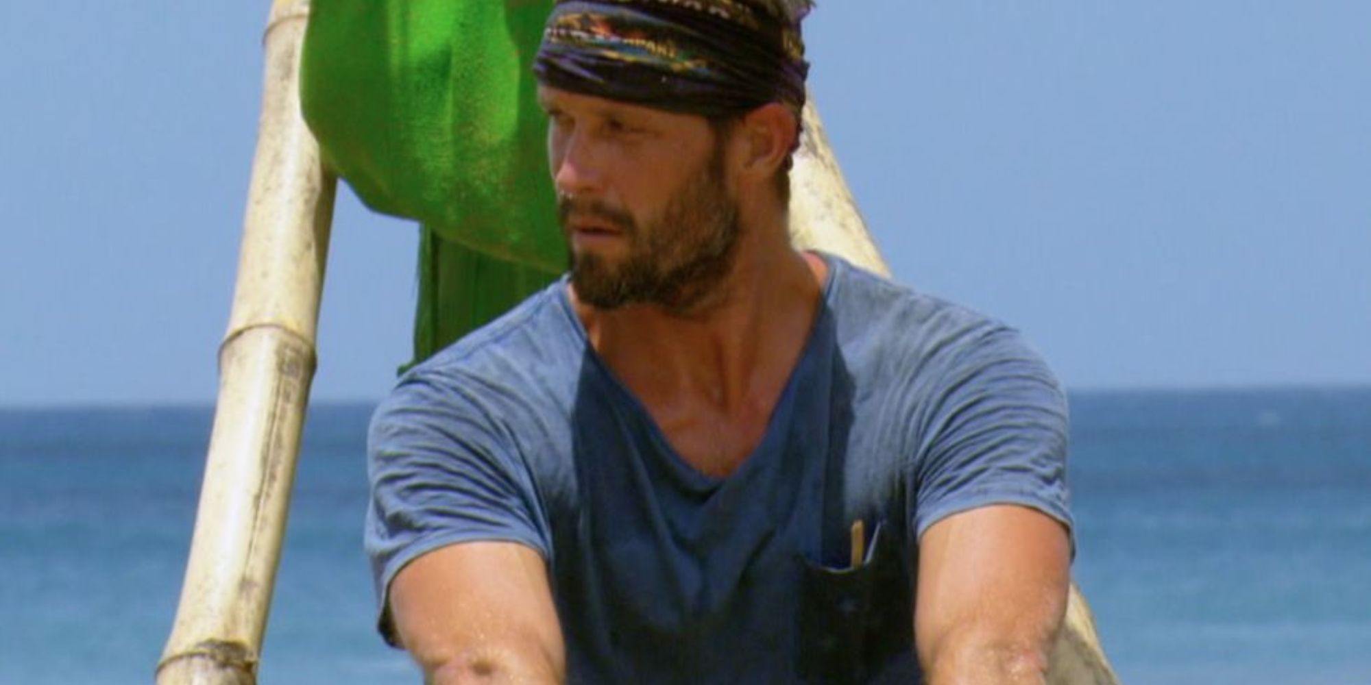 Survivor 30: Worlds Apart Mike Holloway in a blue shirt, ocean in the background