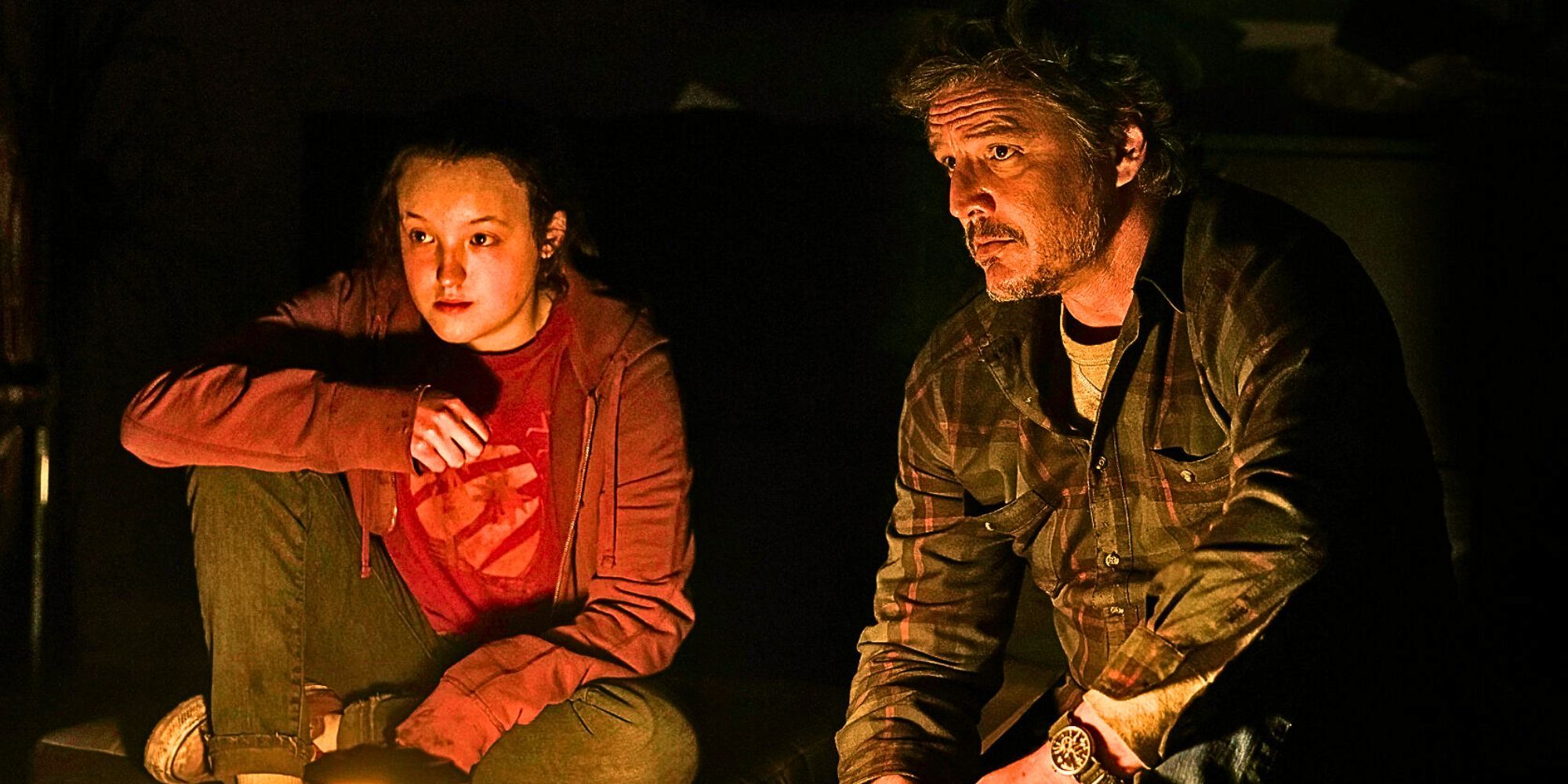 Bella Ramsey as Ellie and Pedro Pascal as Joel looking concerned in The Last of Us