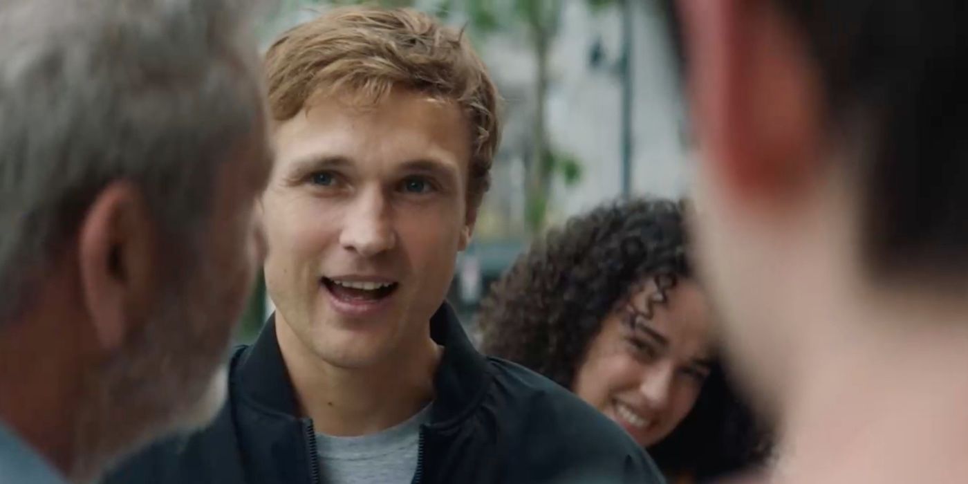 William Moseley's grinning Dylan stands in front of someone in On The Line 2022
