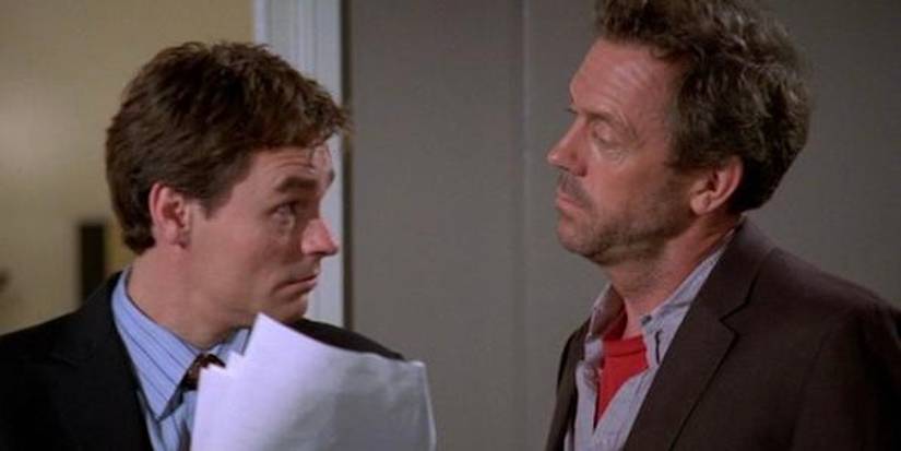Wilson is looking up at House with raised eyebrows. 
