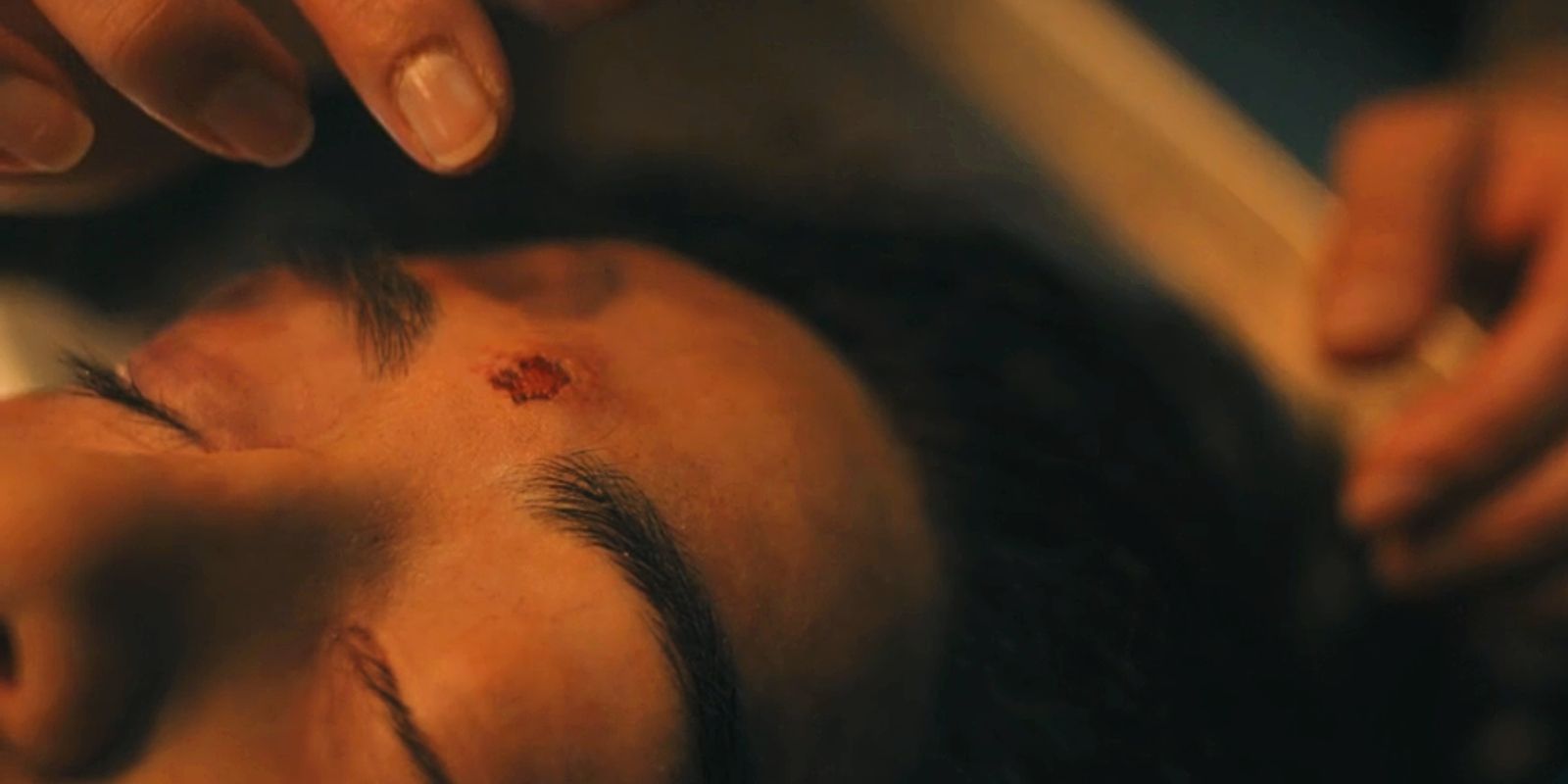 A cigarette burn is on Reena&rsquo;s forehead in Under the Bridge