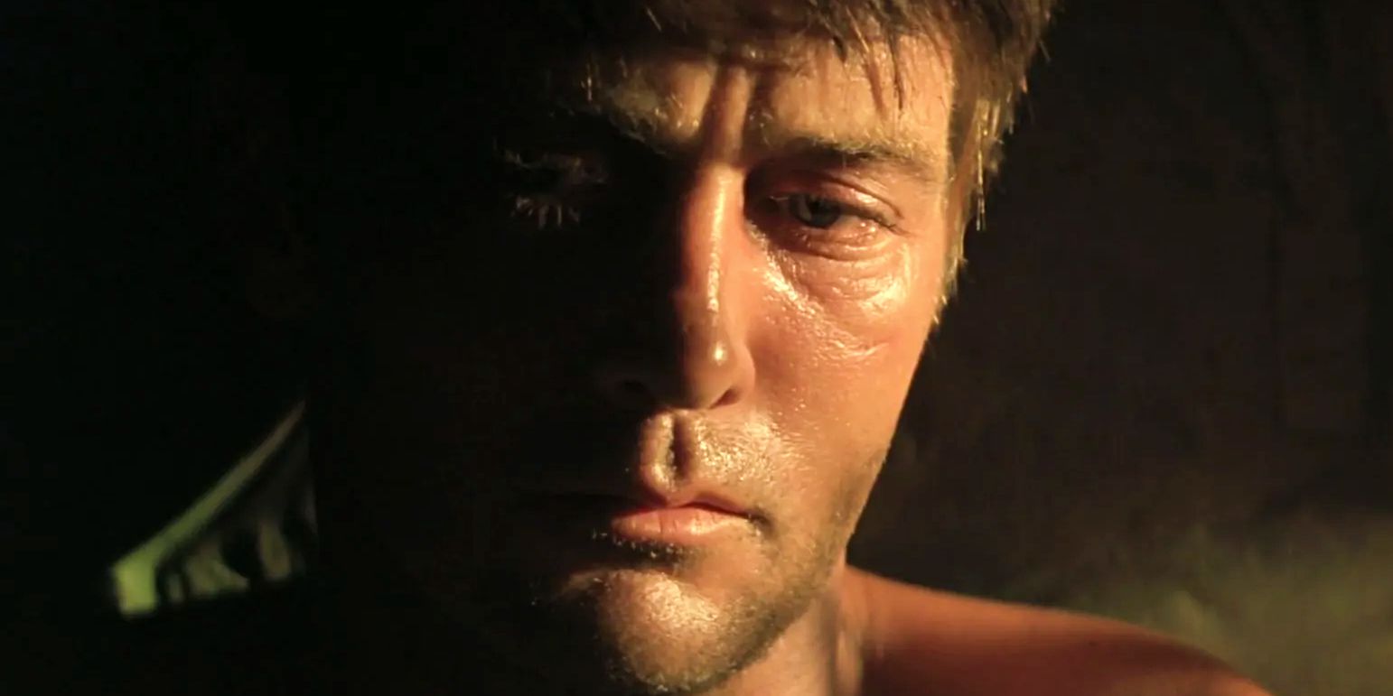 A close-up of Martin Sheen looking dejected in Apocalypse Now