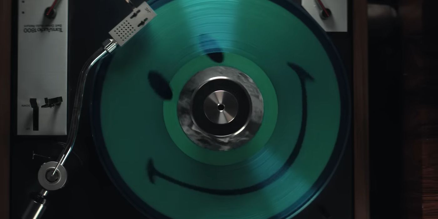 A Spinning Record with a Smiley Face in The Greatest Hits