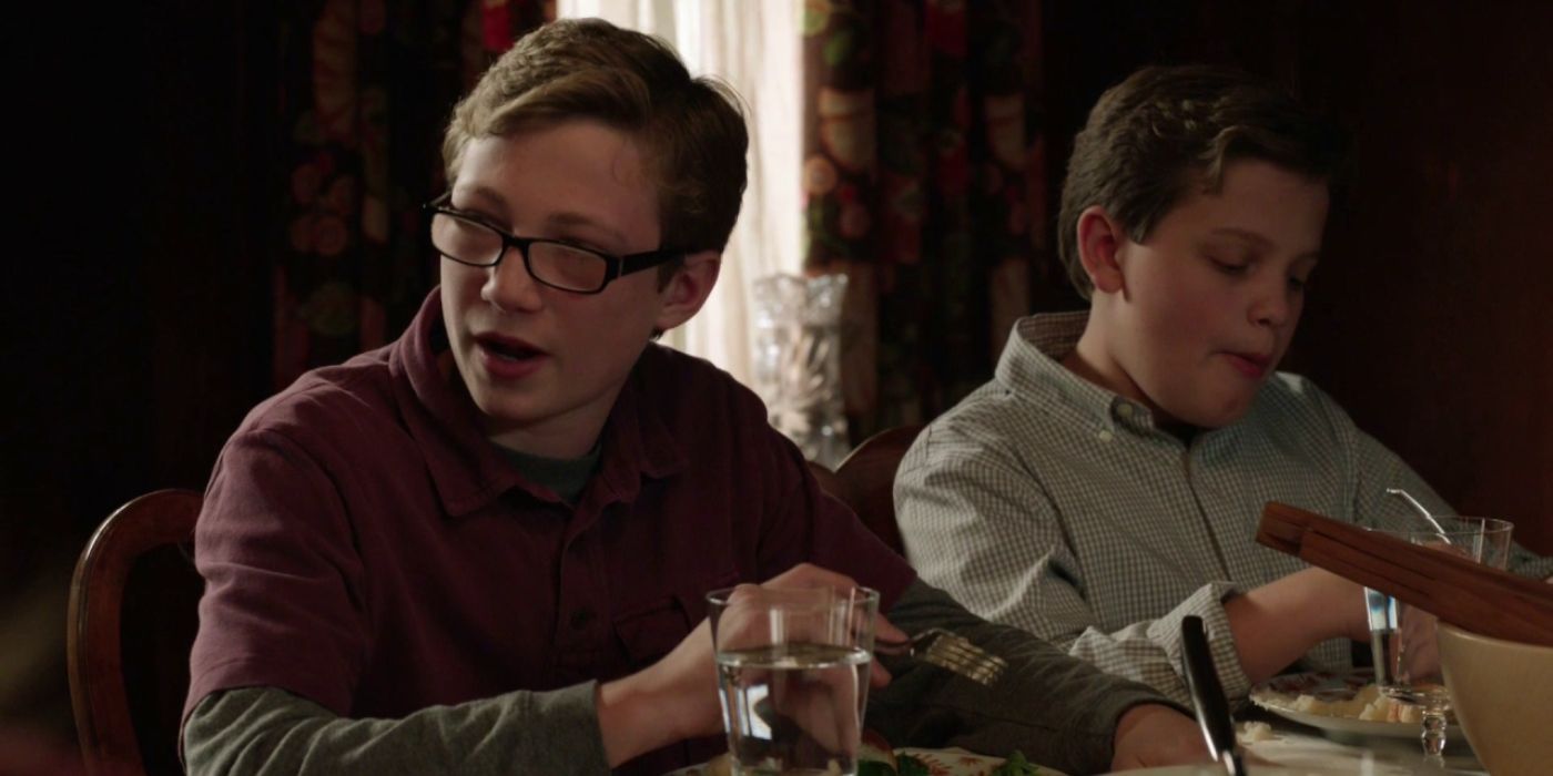 A young Jack Reagan (Tony Terraciano) talking to someone at the dinner table in Blue Bloods.