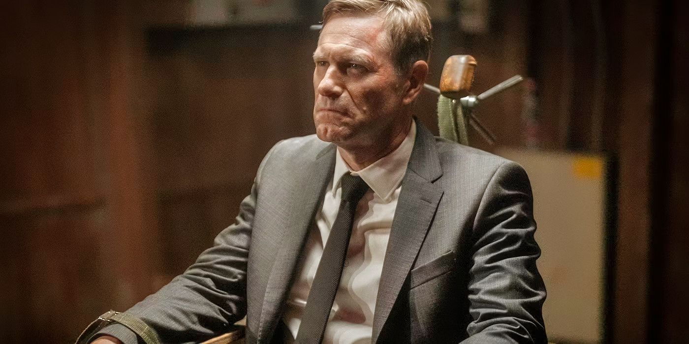 Aaron Eckhart tied to a chair as Ben in Chief of Station