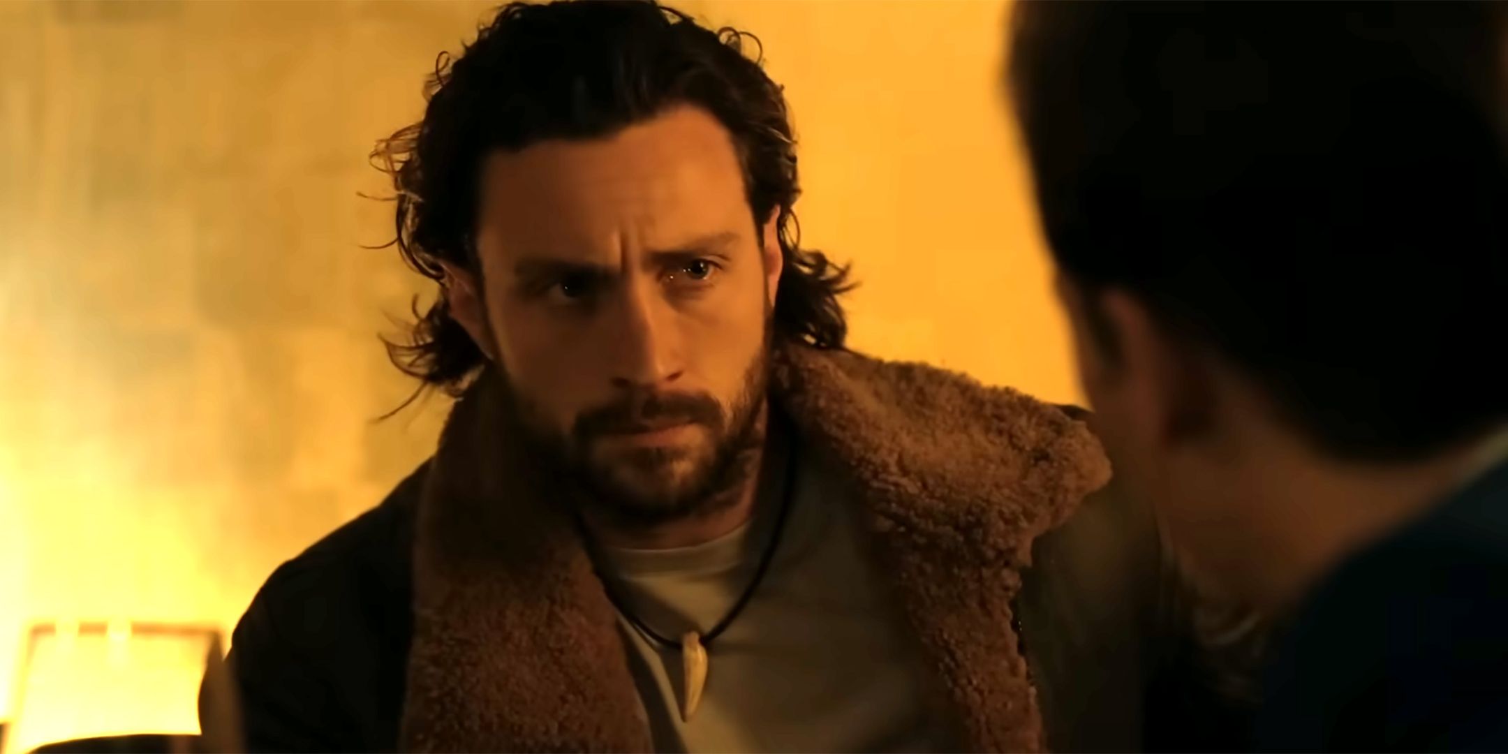Aaron Taylor-Johnson as Kraven looking serious in Kraven the Hunter