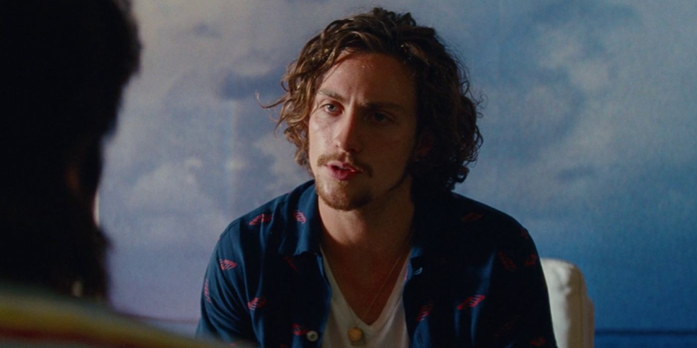 Aaron Taylor-Johnson looks upset in Savages