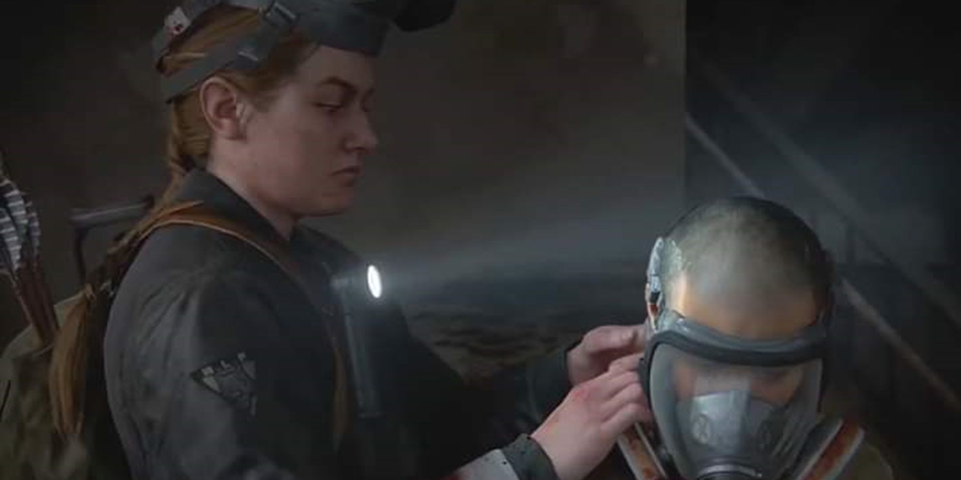 Abby ajuda Lev com sua máscara de gás em The Last of Us Part II