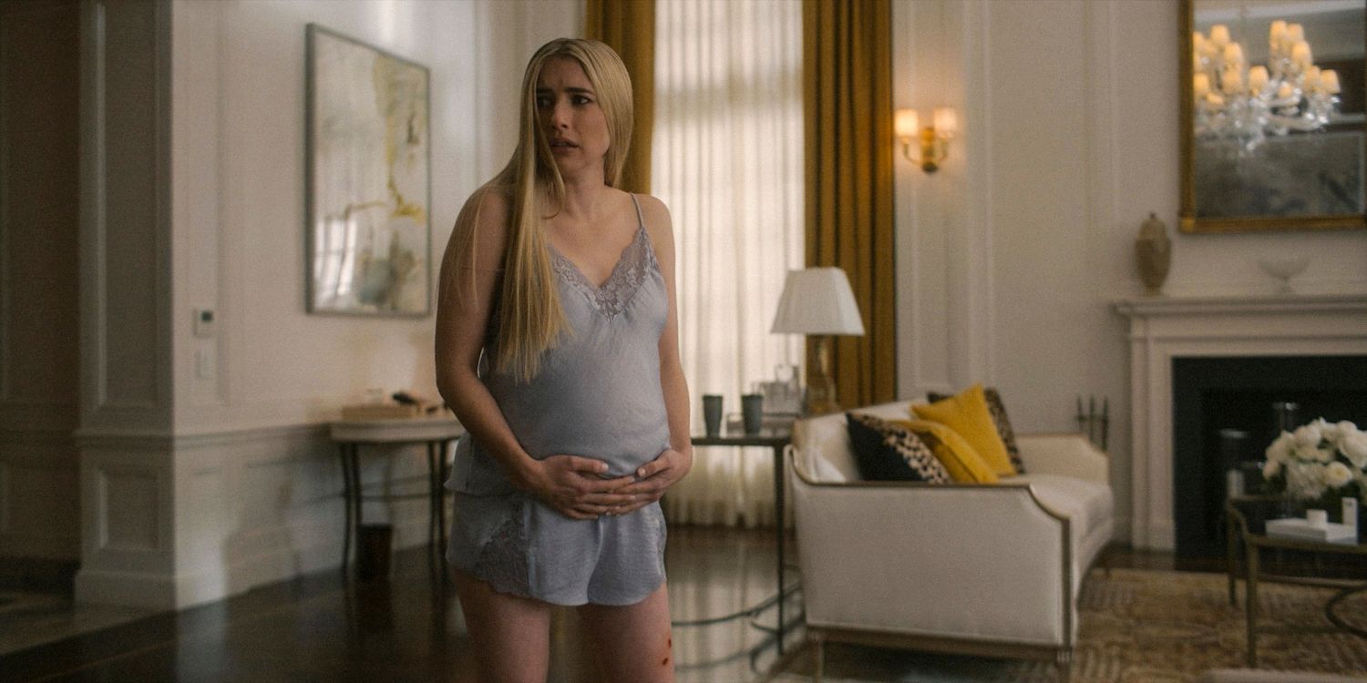 Anna holds her baby bump and has a wound on her leg in American Horror Story: Delicate season 12 Ep 8