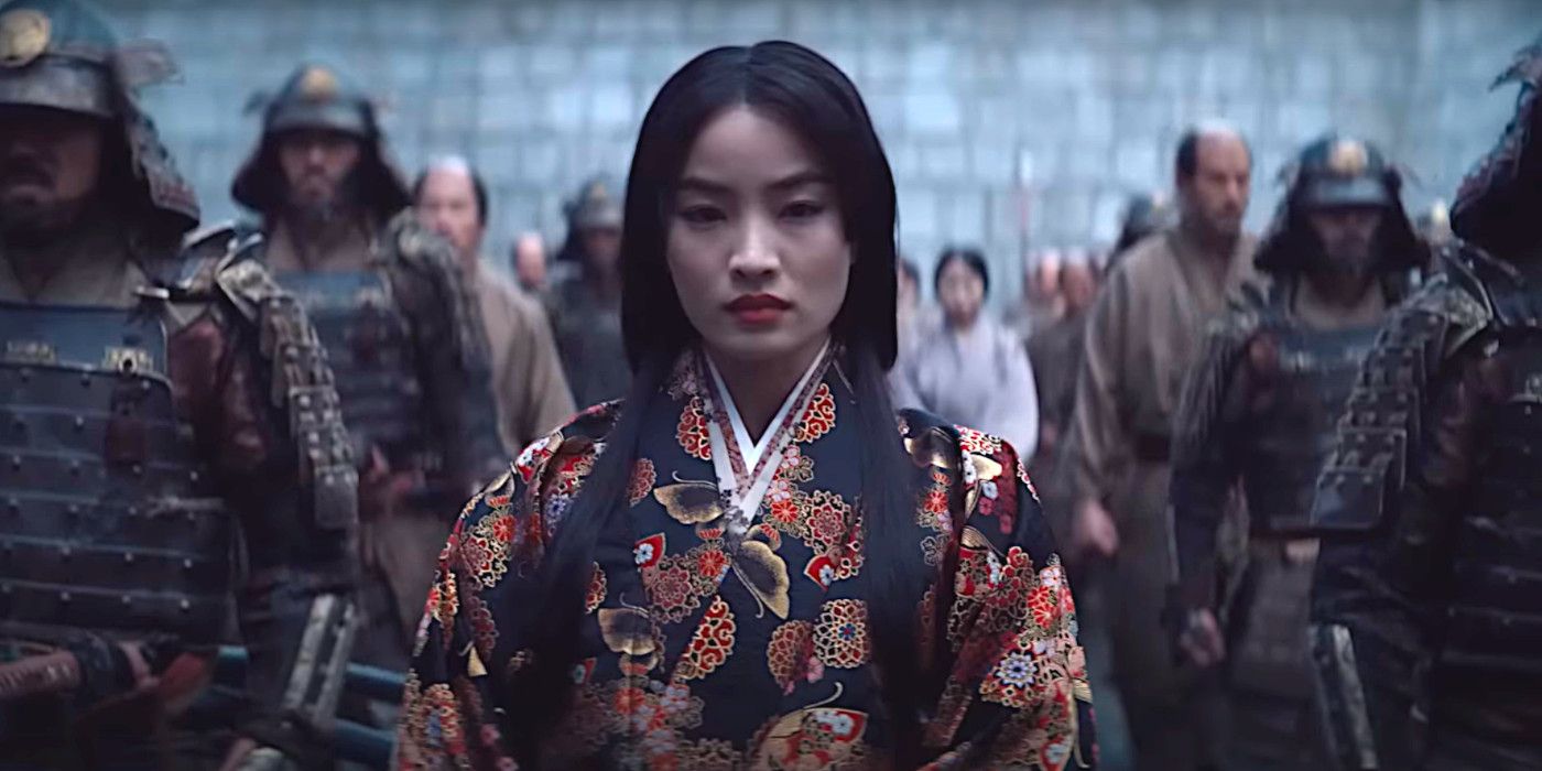 Anna Sawai as Lady Mariko looking determined while surrounded by men in samurai armor in a scene from Shogun