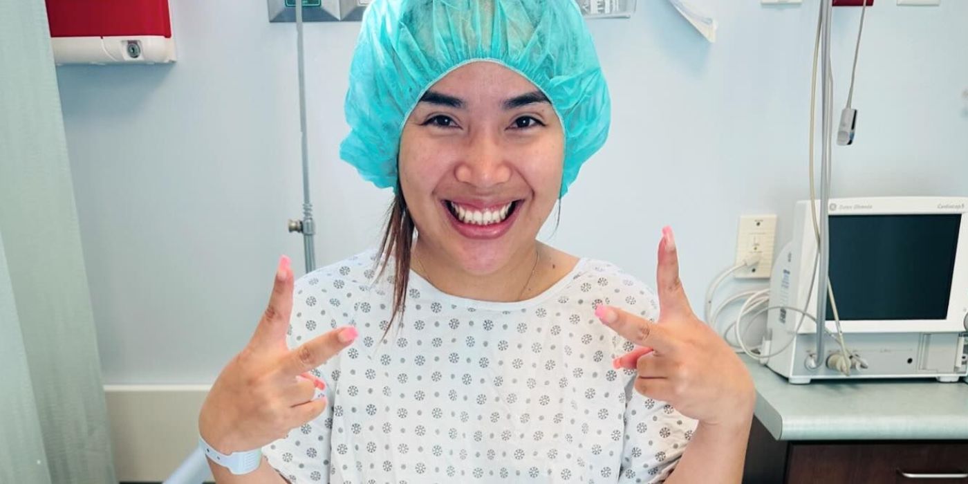 Annie Suwan In 90 Day Fiance with peace signs in hospital gown and cap