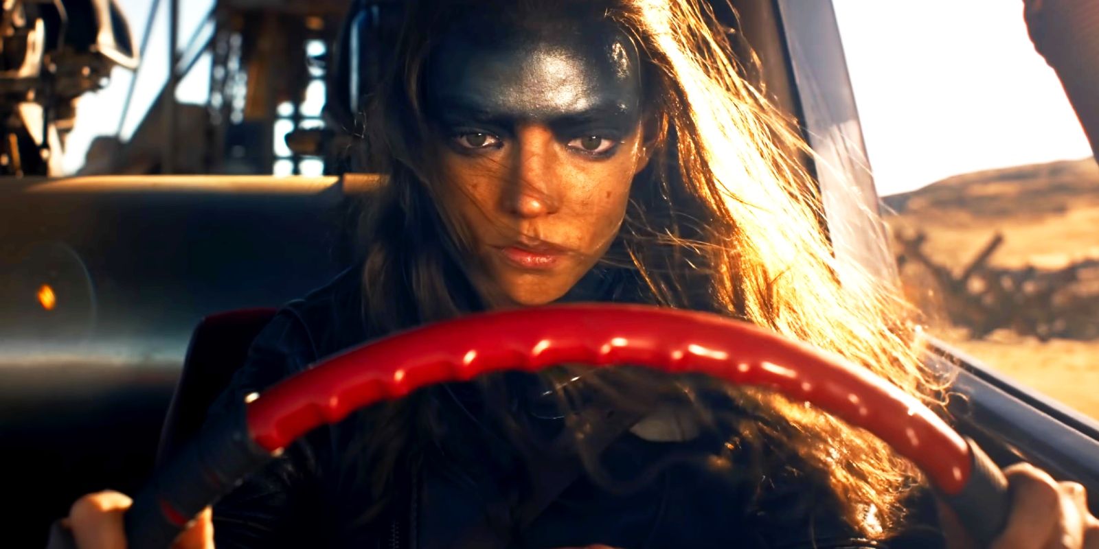 Anya Taylor-Joy behind the wheel of a vehicle in Furiosa A Mad Max Saga