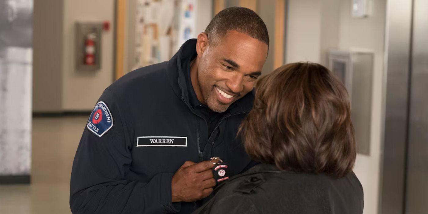 Ben Warren (Jason George) smiles at Miranda Bailey (Chandra Wilson) in the halls of Grey Sloan in a Station 19 and Grey's Anatomy crossover
