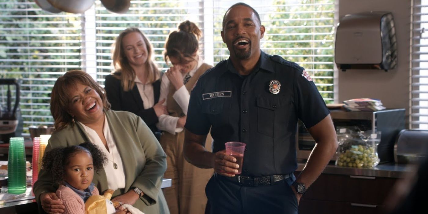 Ben Warren (Jason George) toasts Pru while Miranda Bailey (Chandra Wilson) laughs and smiles in Station 19