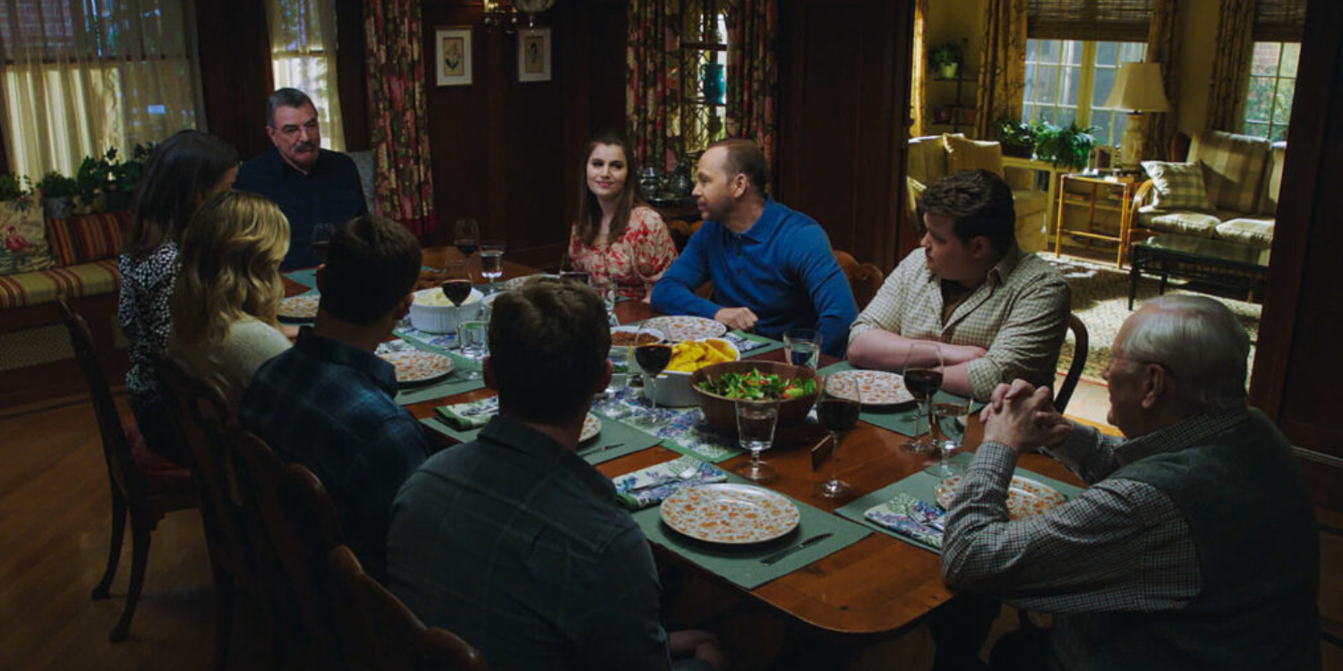 The Reagans sit around a small table on Blue Bloods season 13