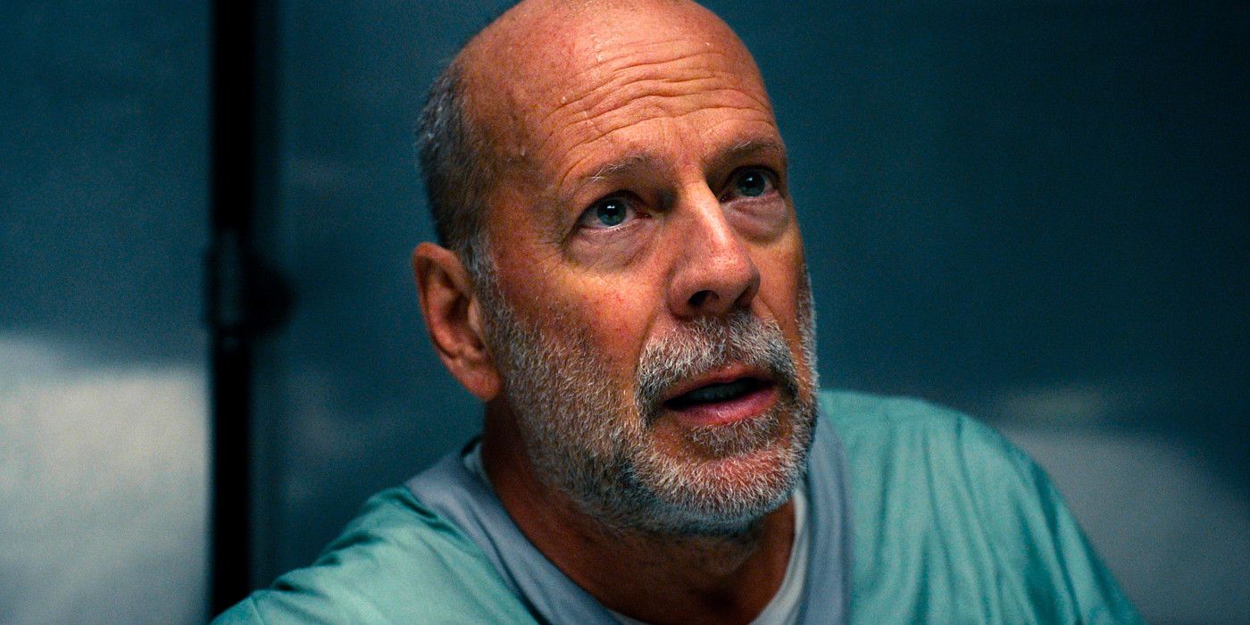 Bruce Willis looks upward while speaking in a scene from Glass